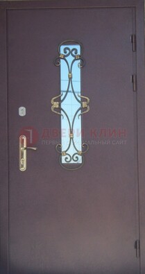 Металлическая дверь со стеклом и ковкой ДСК-77 в Сочи